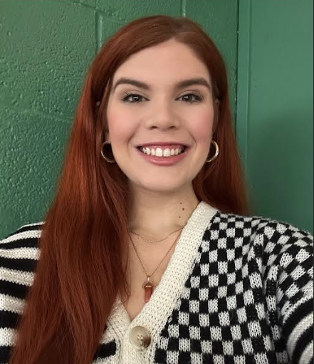 Haylie in a checkered black and white sweater